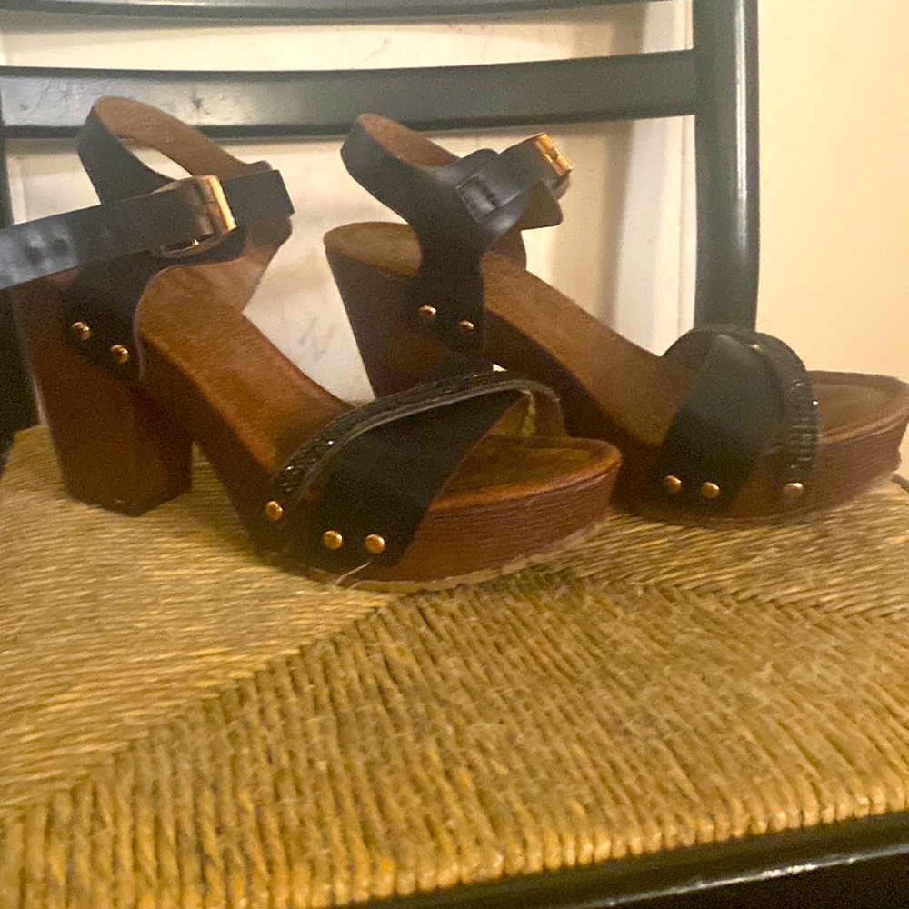 Dark brown wedges wood with black straps and little gold buttons on the side